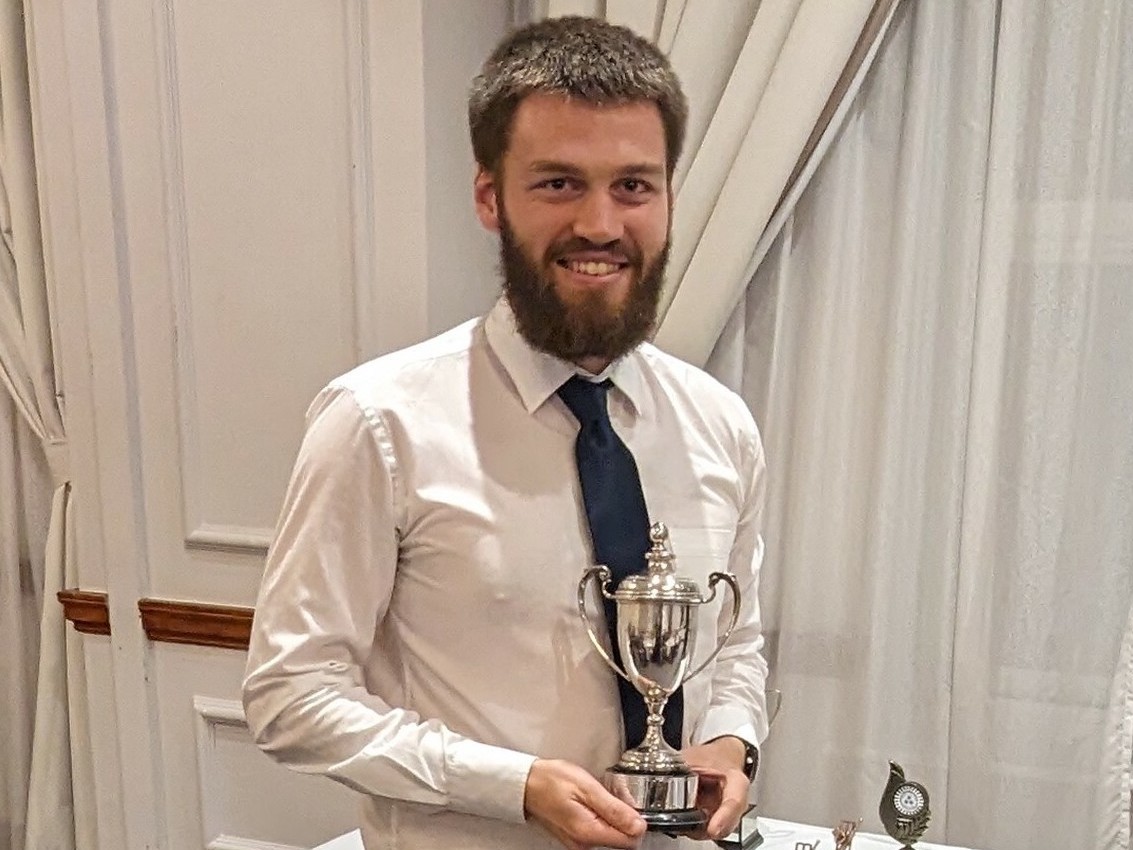 Topsham's Declan Wardell with the Howard Lewis Cup, which is awarded to the club's 1st XI batsman of the year<br>credit: Contributed