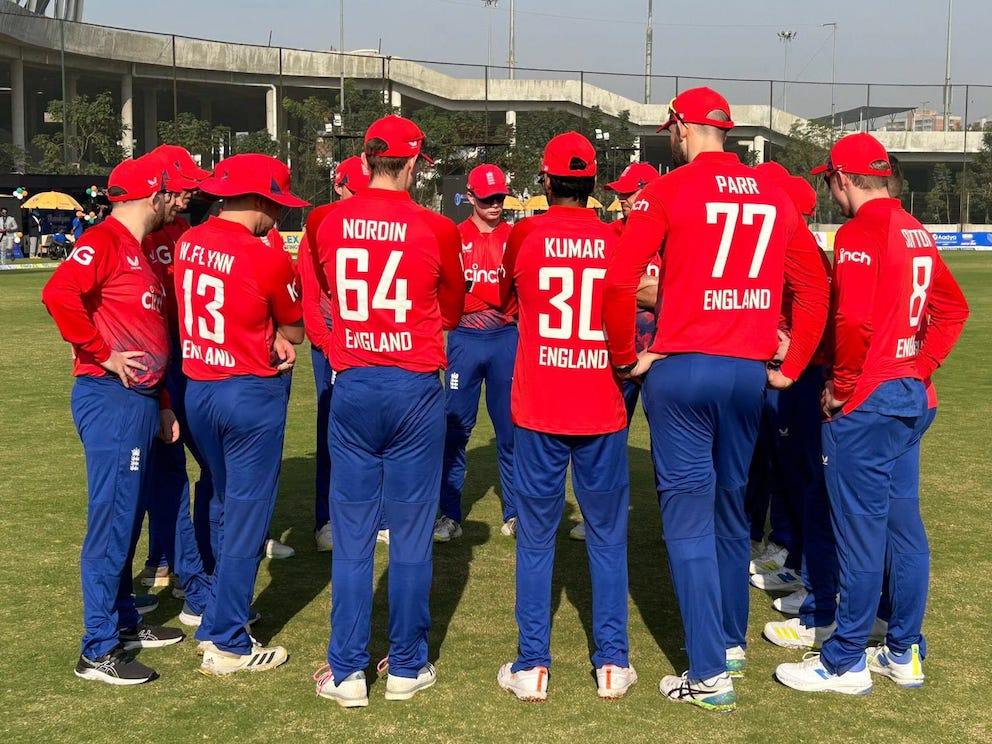 Brendon Parr (No 77) in a team huddle during a game on the B Ground next to the Modi Stadium<br>credit: Conrad Sutcliffe - no re-use without copyright owner's consent