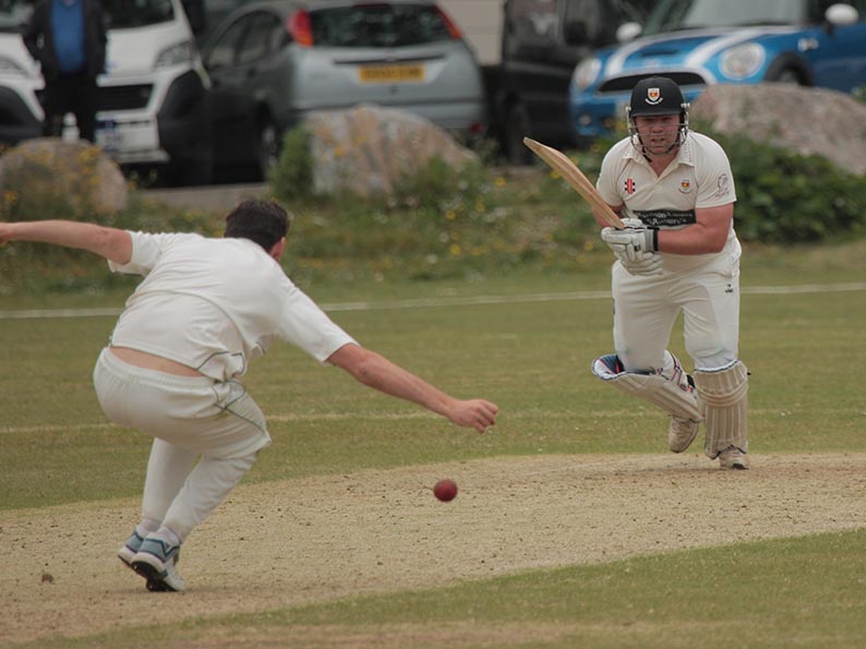 Sidmouth's Matt Cooke steers the ball past Joe Hagan-Burt on his way to a century against Plymouuth<br>credit: All photos: Al Stewart