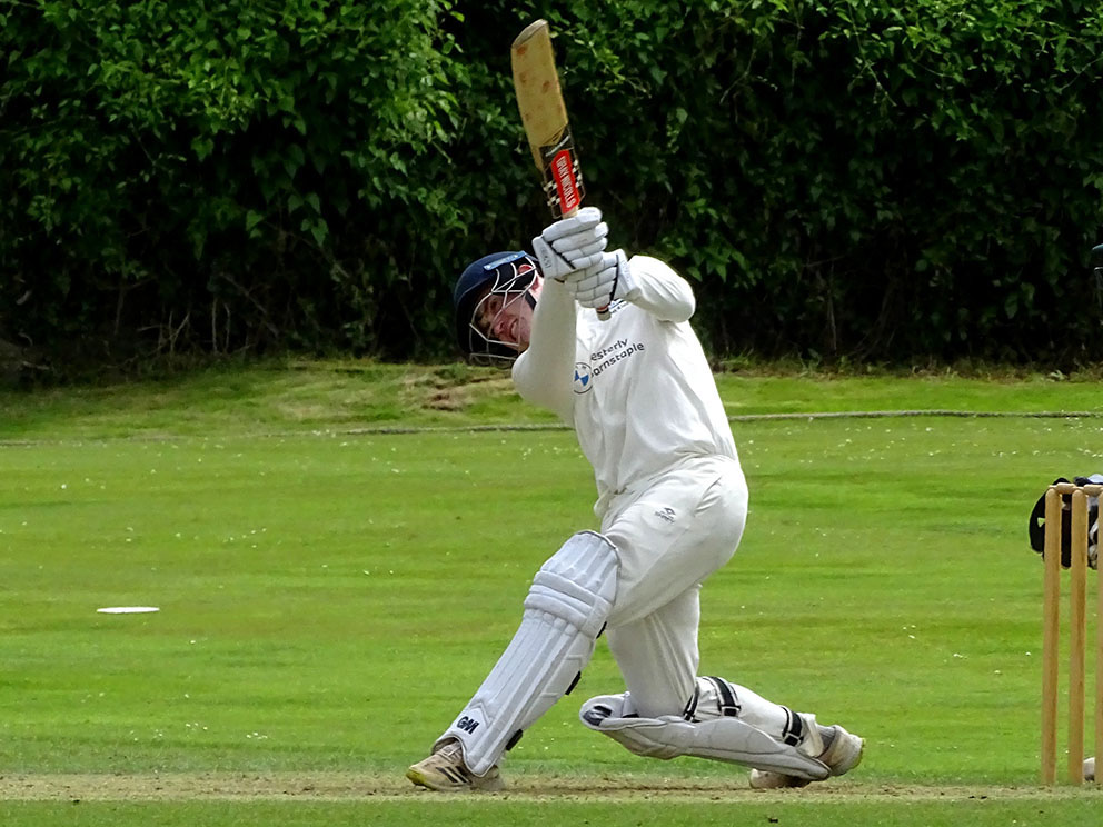 Jack Moore launches one of his 18 sixes in his knock of 166 against Hatherleigh<br>credit: Fiona Tyson