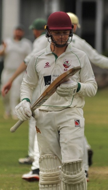 Sidmouth's Jamie Baird trudges off after being dismissed for 13 by Sam Stein