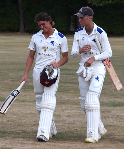 Elliot Hamilton (left) and James Horler make their way off for tea having batted for an entire session against Shropshire