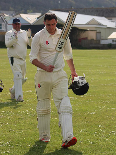 Tom Brend making his way off at the end of Bideford's innings
