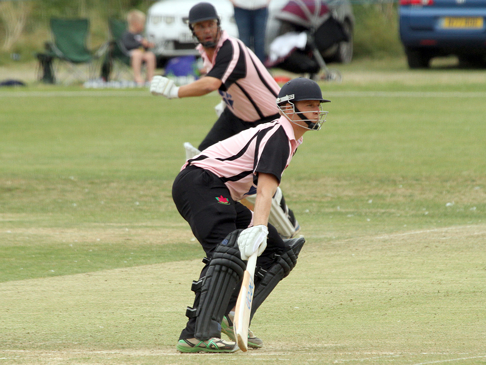 Seb Benton in T20 action for Exmouth. The other batsman is Richard Baggs