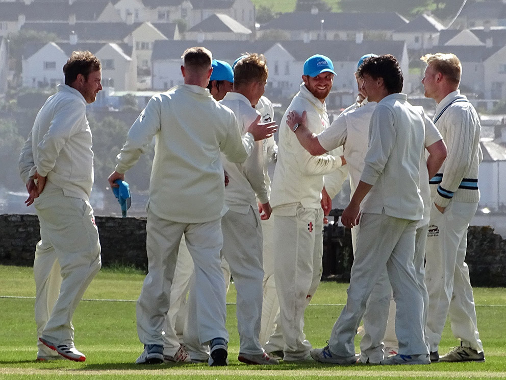  Tom Popham (centre) surrounded by North Devon team-mates during a break in play at Instow last season. 