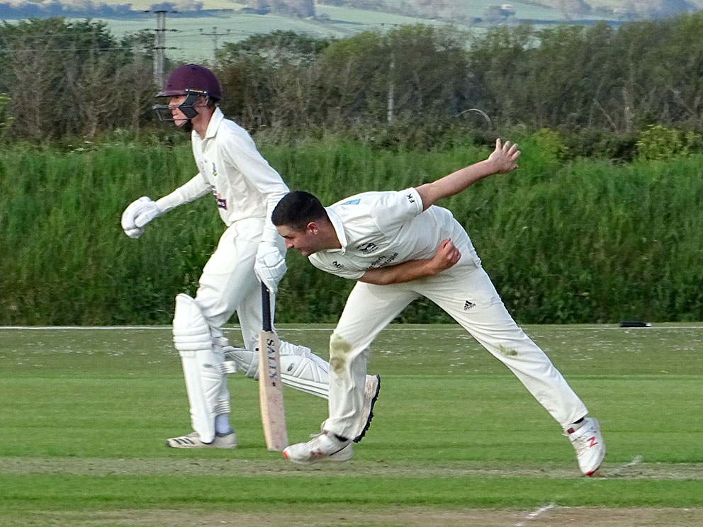 Fred King on the way to a five-wicket haul against Torquay
