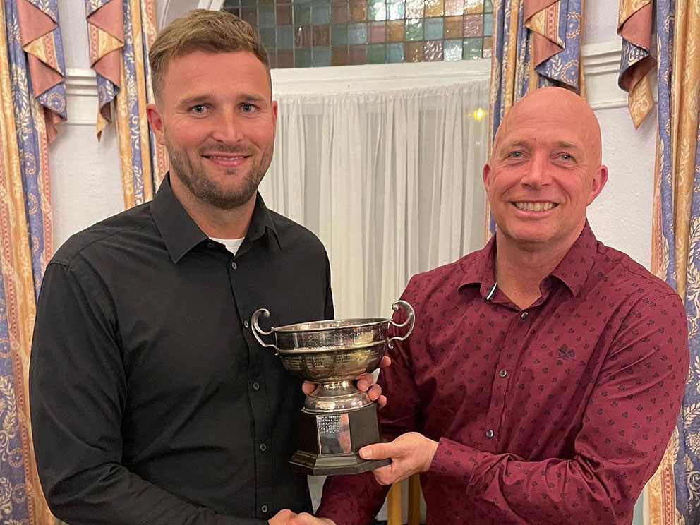 Sam Simcox (left) collecting the Bob Whitburn Trophy for clubman of the year from Paignton CC chairman Tim Ward