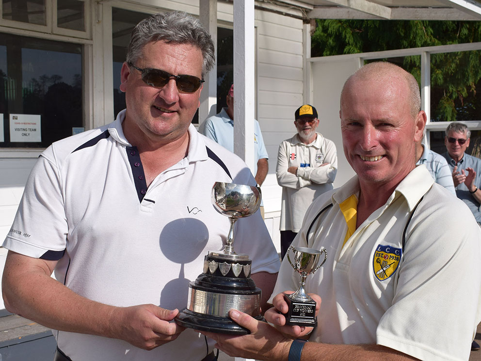 Valeport MD Matt Quartley (left) hands the Brockman Cup to winning captain Mike Wright
