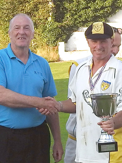 Richard Tidball (left) presenting the cup his company sponsors to Lustleighâ€™s winning captain Mike Wright.