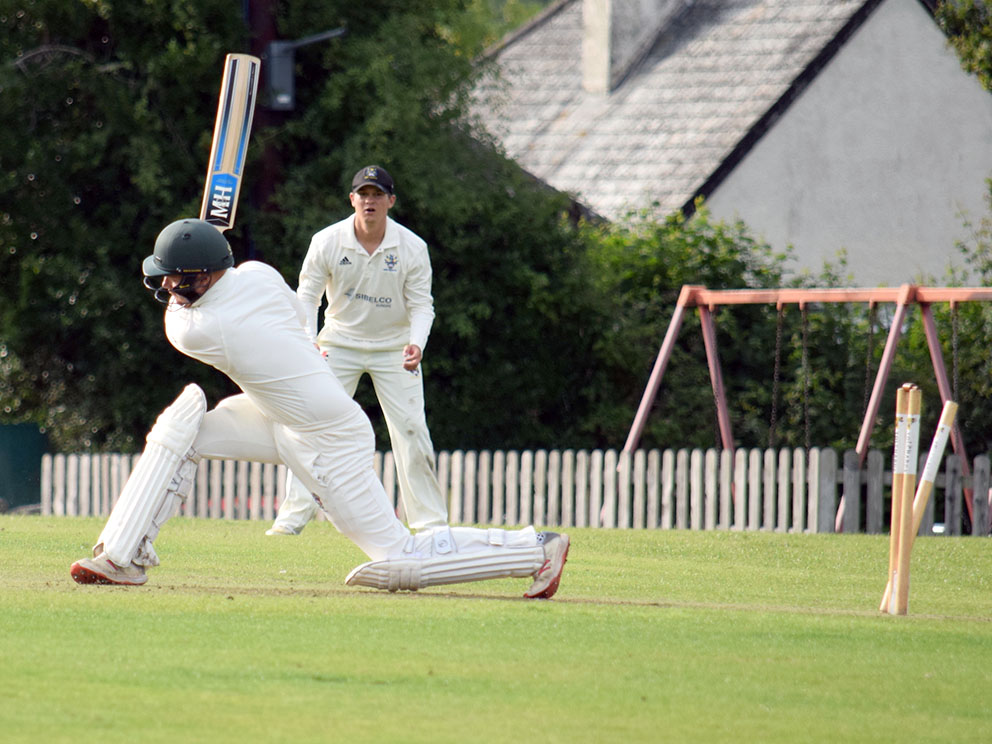Hatherleigh's Niall Leahy has just been bowled by Bovey's Will Christophers