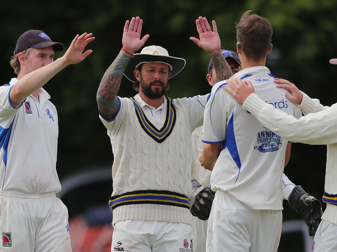 Peter Trego (centre) celebrates a wicket falling when he captained Devon against Cornwall at Exeter in 2019
