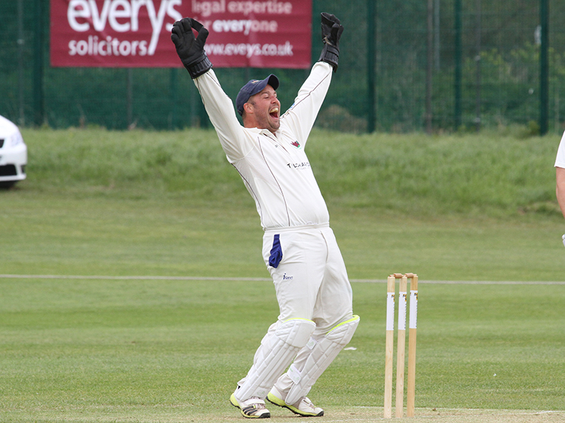 Sandy Allen celebrates the fall of a wicket playing for Exmouth