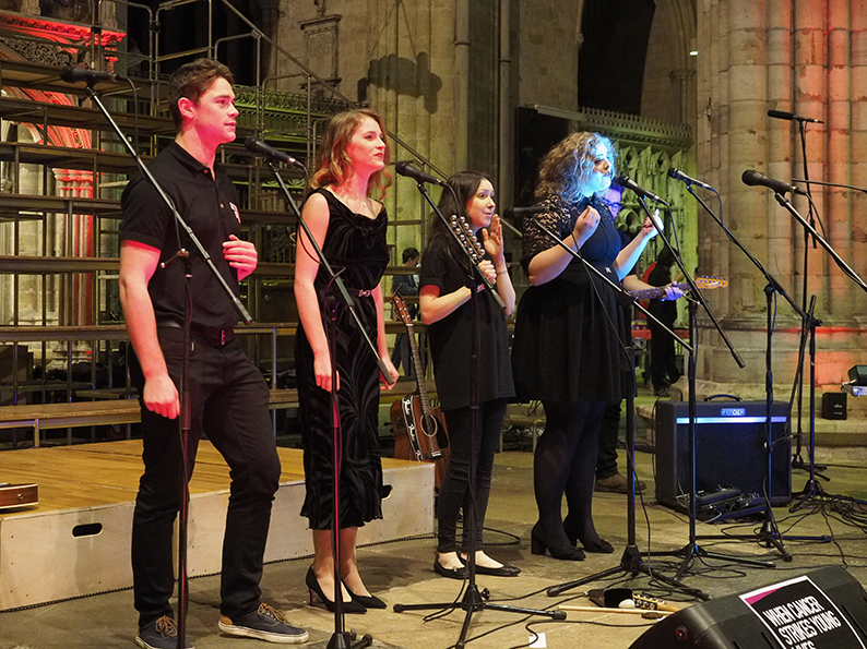 George Stephenson (left) performing for the CLIC Sargent singers in 2016