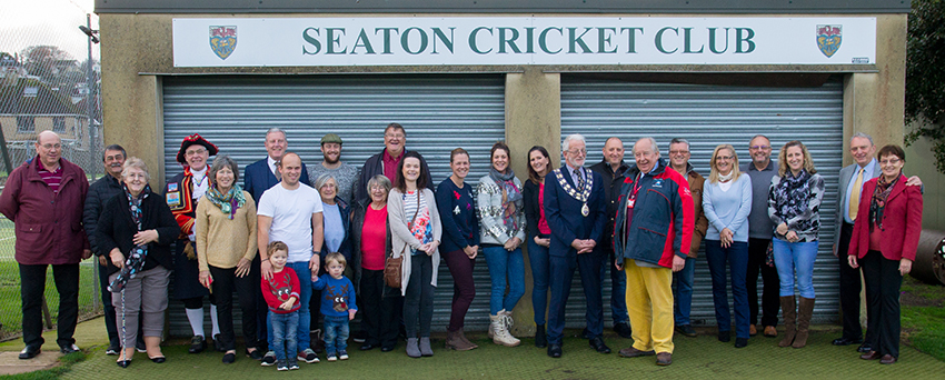Club members, air ambulance supporters and local VIPs pose for a photo at the opening of the new landing area at Seaton CC