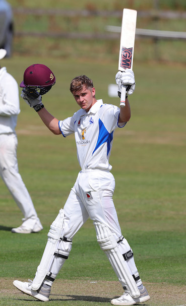 Ton-up! Tom Lammonby raises his bat after reaching his first century against Wales