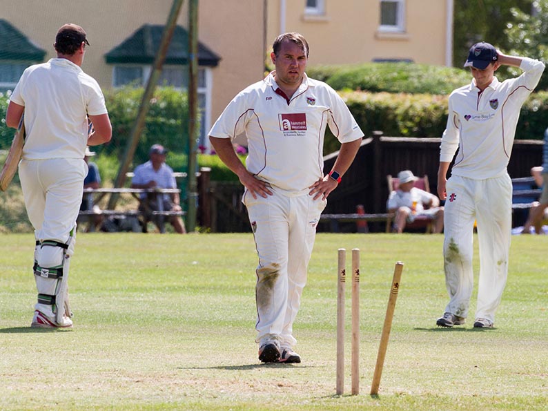 Seaton's Rob Prior surveys his handiwork after dismissing Abbotskerswell batter Tom Kelly, who was on 144 when dismissed
