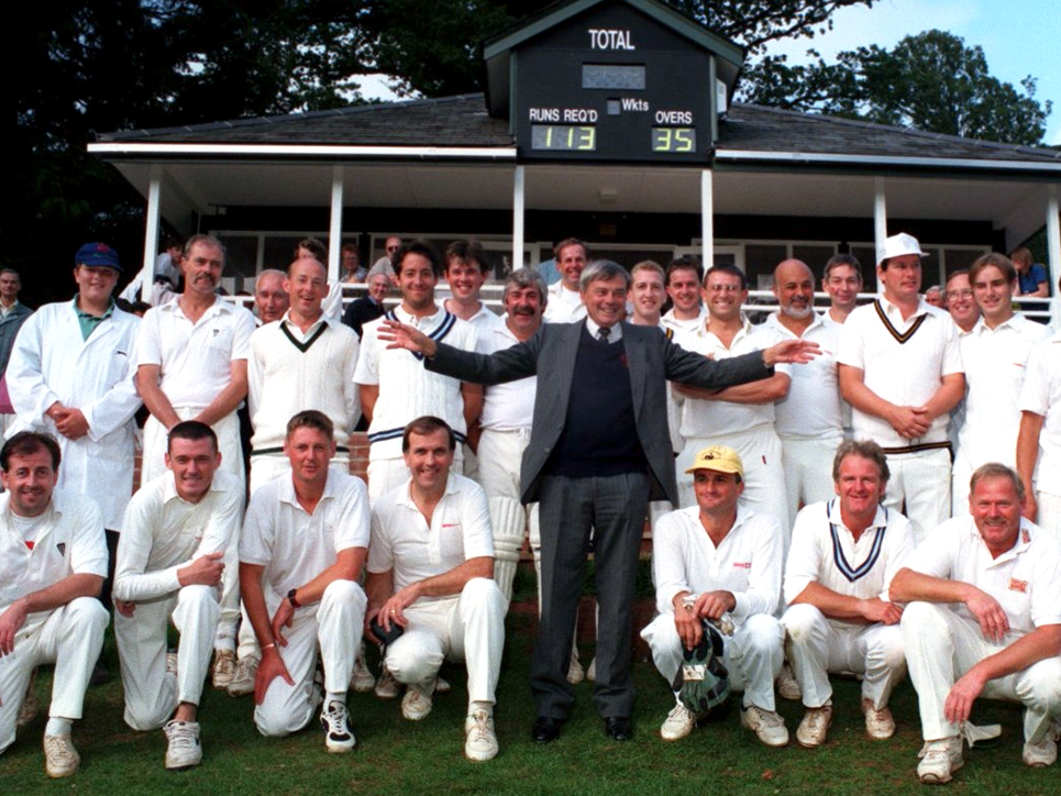 Former Test umpire Dickie Bird was invited to open the new cricket pavilion at Cockington which replaced the one burned down by arsonists in 1997. He is pictured with the teams of Cockington and Chelston cricket clubs before their match in 1998