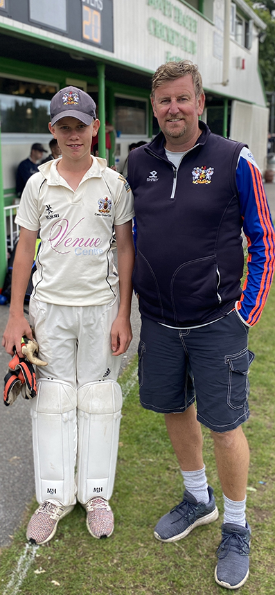 Ollie Gribble (left) and dad Mark outside the pavilion at Bovey Tracey