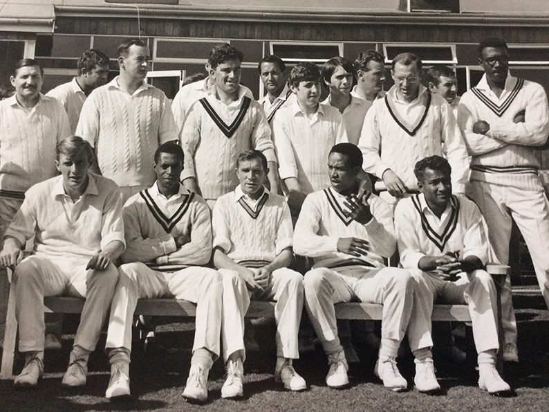 Players from both sides caught by the cameraman at the game between Exeter St Thomas and the International Cricket Cavaliers in September 1968. Tony Wright is third from the left in the back row -full  caption below