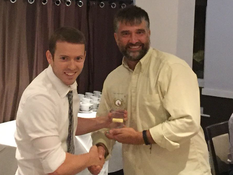 Chris Yeo hands over the 2nd XI all-rounder award to Marcus West