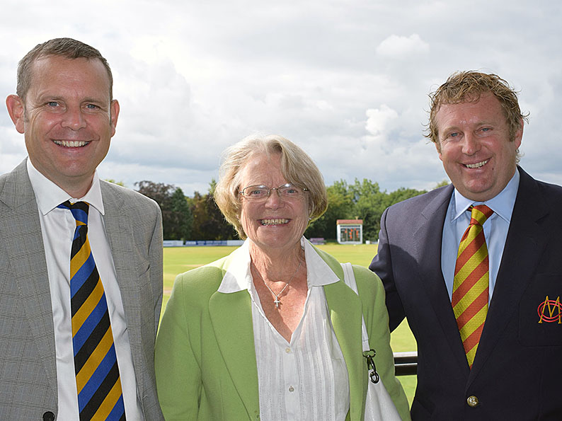 Left to right are Matt, Ruth and Greg Evans on the pavilion balcony at Exeter with the new scoreboard twinkling in the background<br>credit: Conrad Sutcliffe