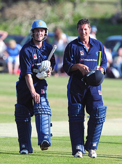 Bob Dawson (right) and Marshall Hood walk off the field at Exmouth after Devon had defeated a Somerset XI in a T20 challenge match in 2009