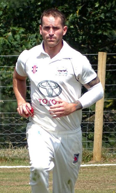 Josh King running in to bowl for North Devon | Fiona Tyson