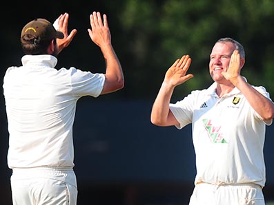 Celebration time for Alphington's Stuart Shaw (right) after claiming a wicket against Exeter 2nd XI