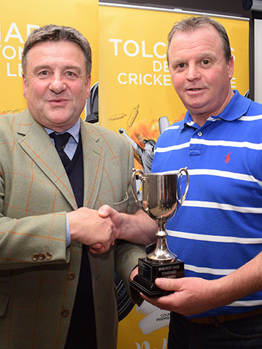 Paignton's Terry Farkins (right) collects the D West winners' trophy