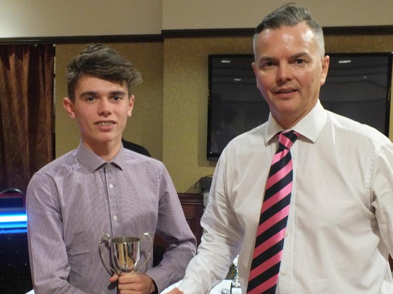 Will Christophers collecting Bovey 2nd XI's batting award from dad Jerry, the team captain