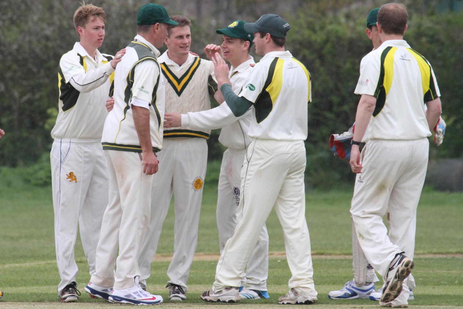 Budleigh Salterton celebrate the fall of a wicket - will they be celebrating promotion in September?
