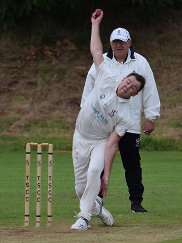 Ross Abraham bowling down the hill for Teignmouth & Shaldon in the win over Brixham