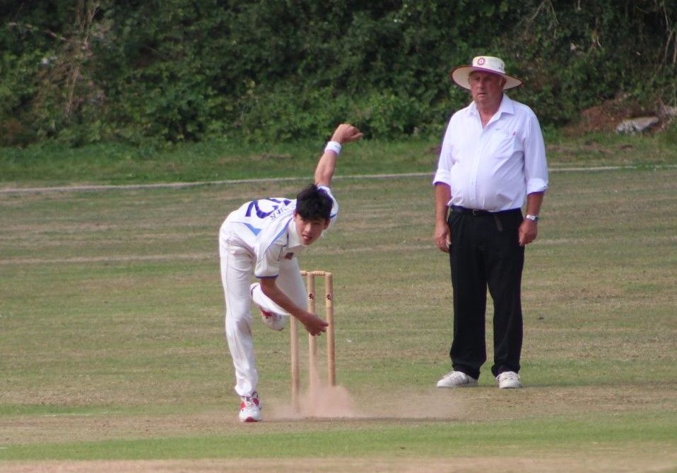 Otty Yip bowling at pace for Devon under-14s against Gloucestershire