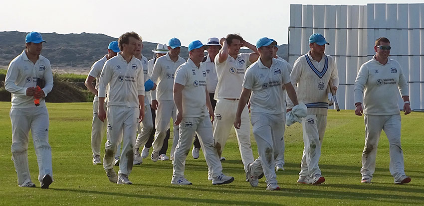 Fred King leading North Devon off after they had defeated Torquay