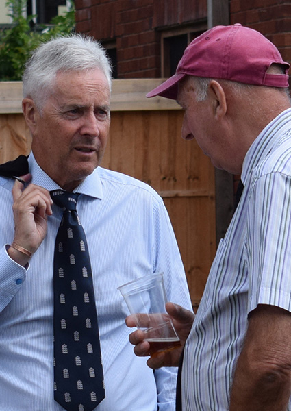 Former England cricketer John Childs in conversation with Michael Hunt at the reception that followed Bert Mitchell's funeral
