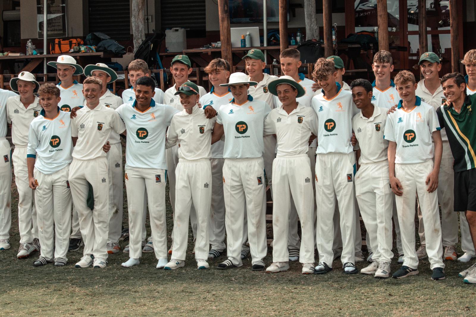 Devon Cricket U15s and Nelspruit Hoërskool pose after the game in 2022.