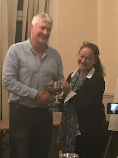 Mr Massey collects 'Player of the Season' award on behalf of his daughter, Charlotte Massey from Chairperson Susannah Maxa