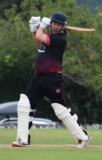 Exmouth's Richard Baggs putting bat to ball in the final