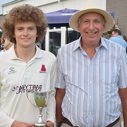 Man of the match Luke Medlock after receiving his trophy from Michael Hunt