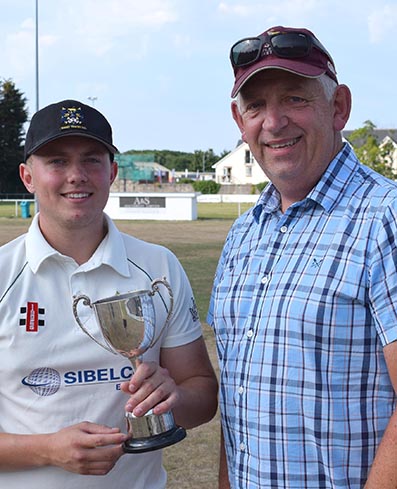 Ollie Clifford-Bourne (left) accepts the man-of-the-match award from Keith Wakeham