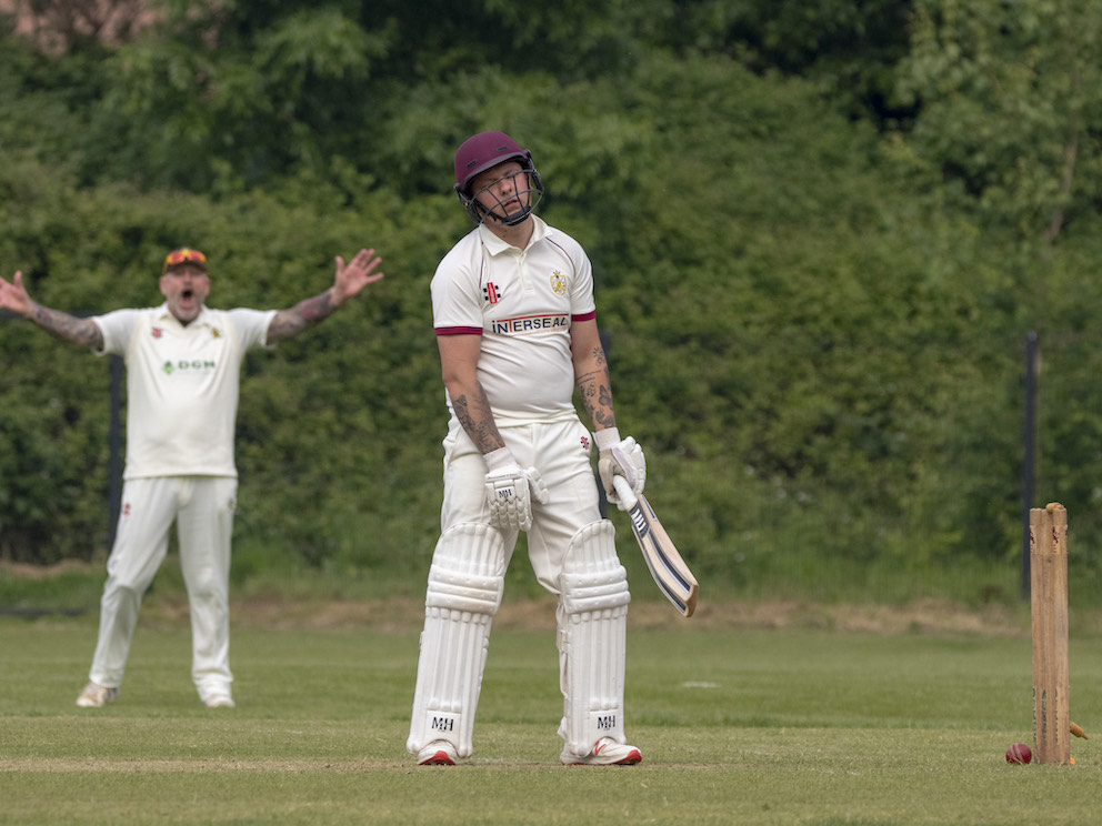 Plymouth CS&R batter Jack Carlisle has just been dismissed – to the delight of Abbotskerswell fielder Andy Lock<br>credit: Al Stewart
