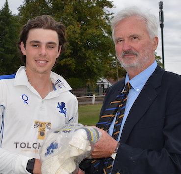 Callum Harvey being awarded his county sweater by Devon chairman Guy Curry