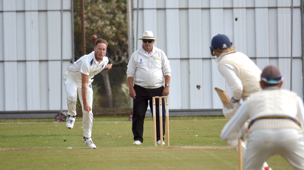 Devon seamer George Greenway flings down a delivery at Oxfordshire's Freddie Smith