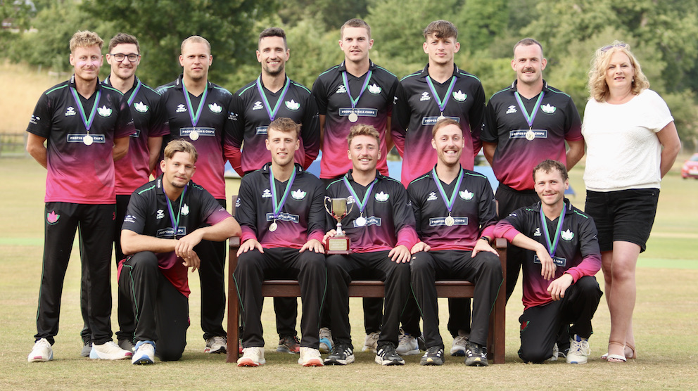 Exmouth's 12-man cup winning squad – and scorer Rachel Tozer – pose for photographer Dan Trott