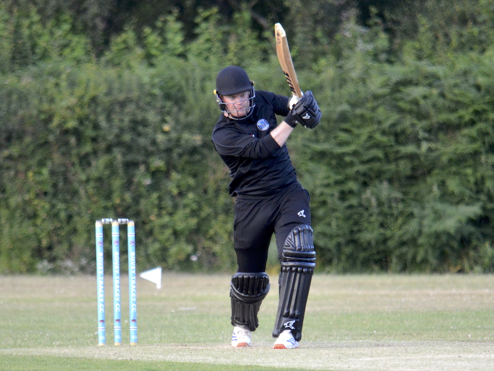 Ashburton's Lloyd White smacks a four back past the bowler