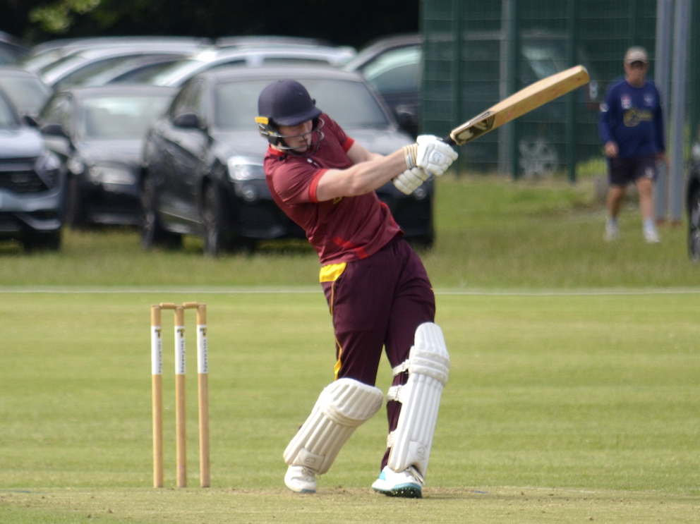 Ipplepen's Toby Holroyd sets about the Babbacombe bowling