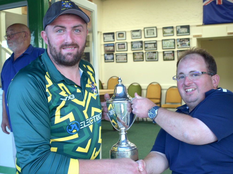 Bovey's Dan Green collecting the Aaron Printers Narracott Cup from competitin secretary Mark Lovel