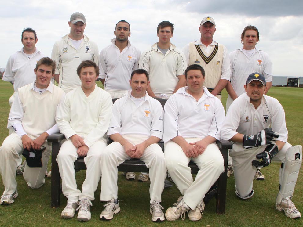 Braunton by the seaside at Sidmouth in 2010. Jon Baglow is third from the left in the front row. Back (left to right) Andrew Paddison, Jody Abbott, Walid Iqbal, Barny Huxtable, Mark Mitchell, Jonathan Higgs; front: Ben Reichstein, Jack Spicer, Jonny Baglow, Mark Lathwell Ian Roberts.