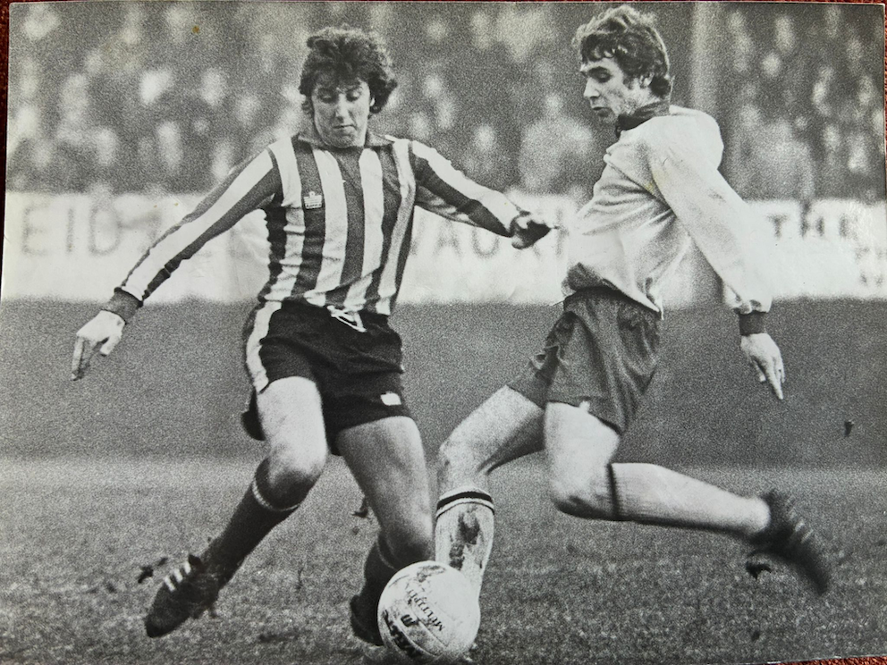 Graham Weeks (left)  gets struck in playing for Exeter City