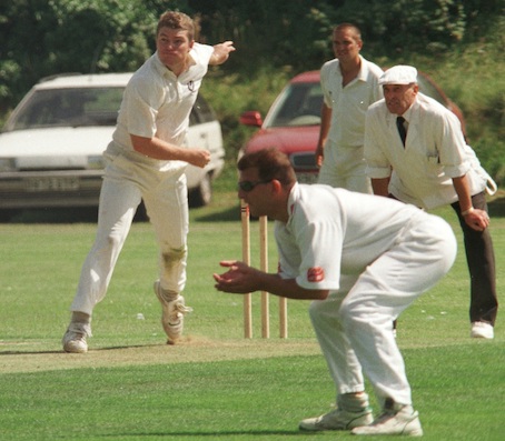 Stuart MacGill bowling at Exmouth in 1998, when he briefly returned to Devon for a second spell